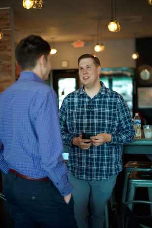The Pentecostals of Manhattan Church Manhattan KS Families man talking to the pastor
